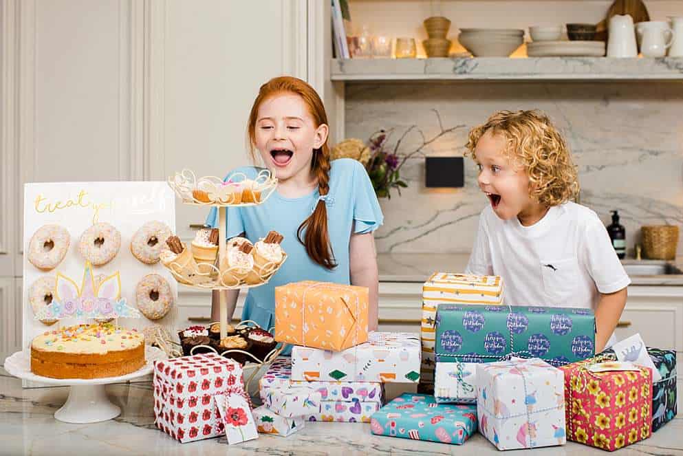kids-joyful-at-birthday-with-cakes-commercial-photographer-london