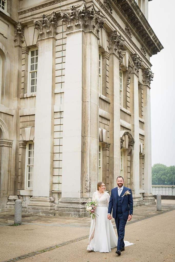Groom-and-bride-holding-hands-fine-art-wedding-portrait