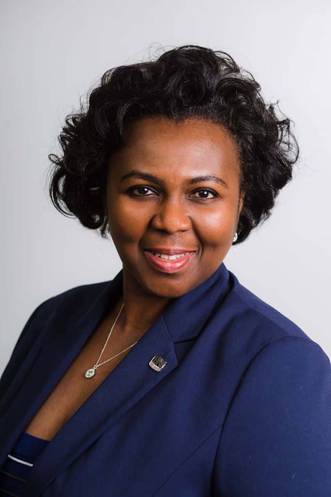 corporate-headshot-photography-nigerian-woman-blue-suit-head-to-chest-close-up-photo-business-portraits