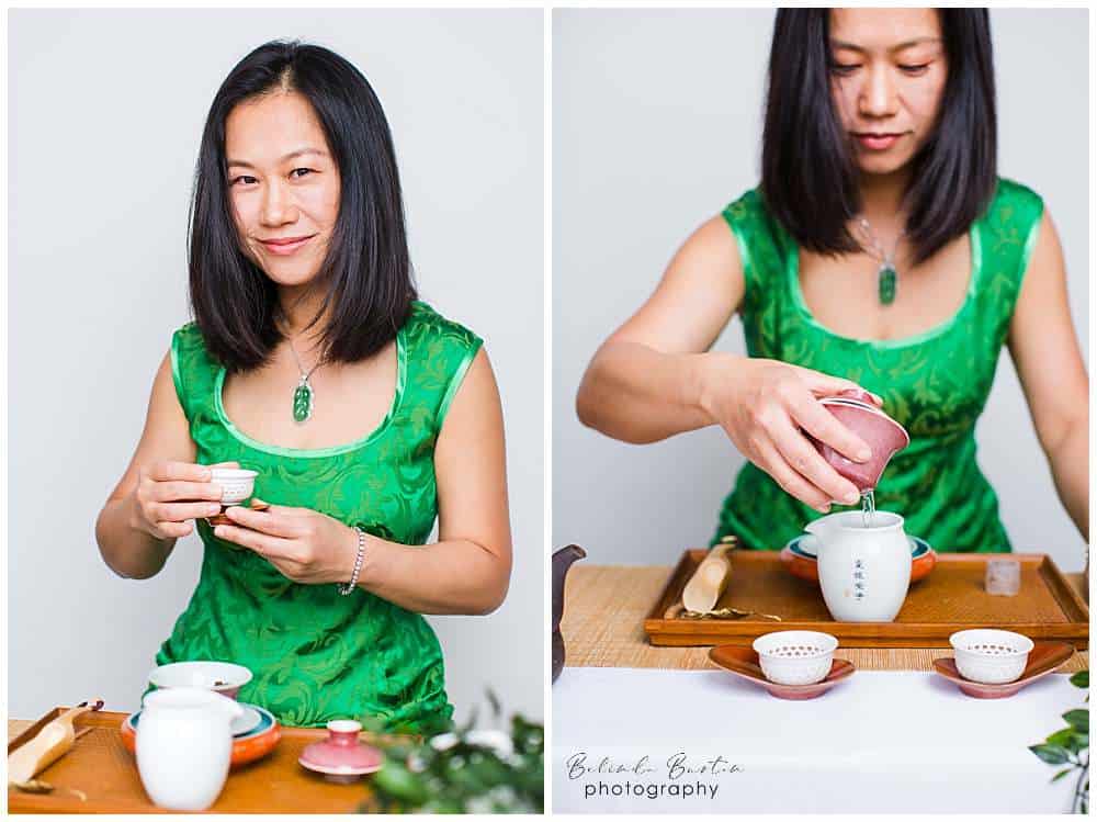personal-brand-photography-best-clothing-consider-authenticity-and-profession-chinese-executive-coach-dressed-in-jade-green-chinese-dress-hosting-tea-ceremony-in-branding-photography-london