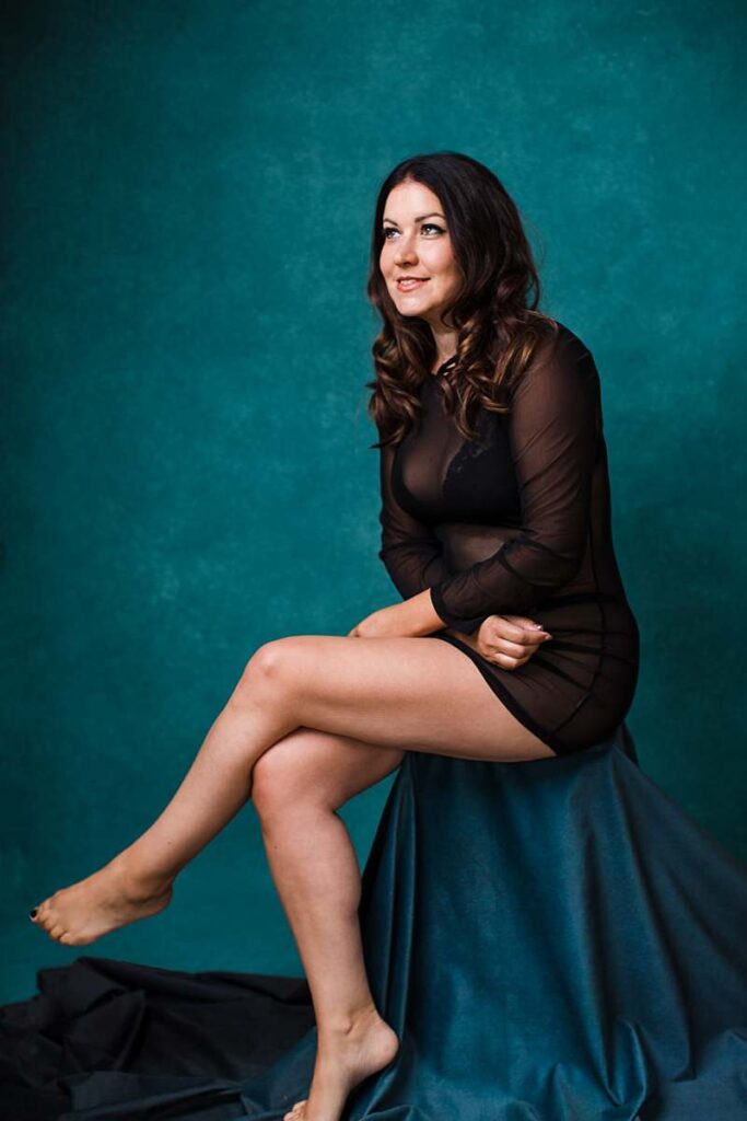 boudoir-photography-london-girl-in-black-sheer-dress-black-lingerie-sitting-pose