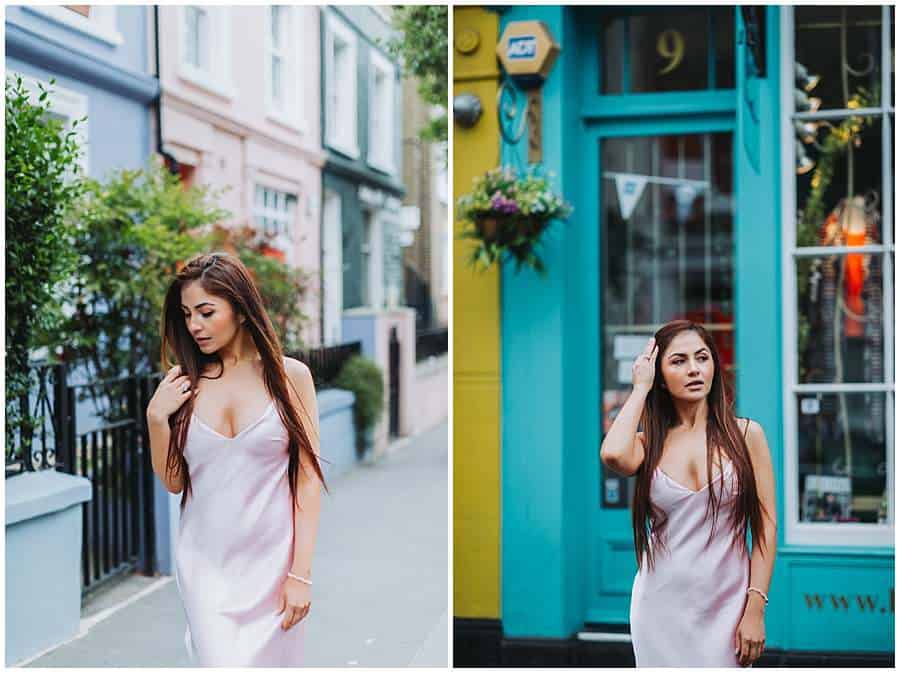 Woman in a satin dress posing on a pastel-colored street and in front of a teal shopfront in Notting Hill, London