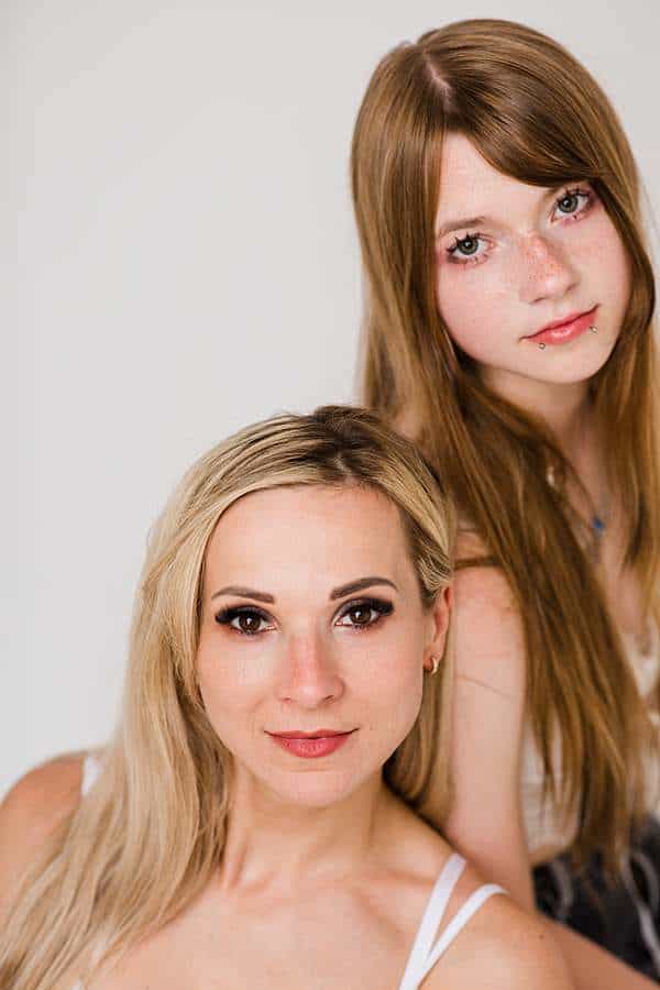 Casual mother and daughter photoshoot in London studio with white tops and jeans